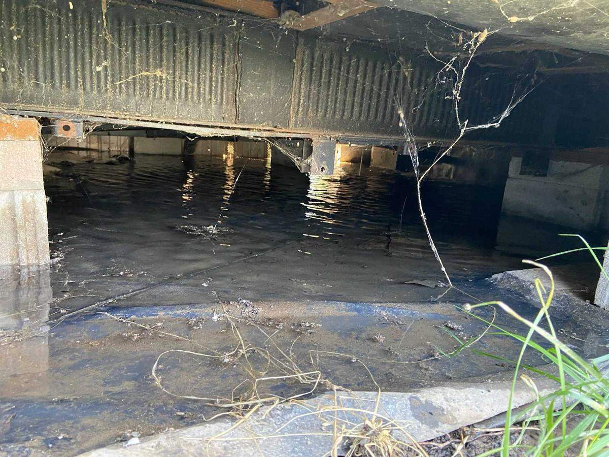 The underneath of Laura Thrash-Wendell’s trailer after a water main break.