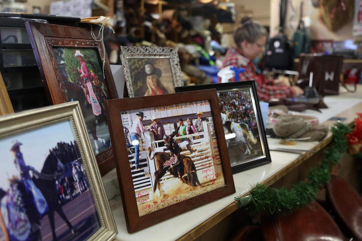 Carol Tallman has worked on leather goods at Hap Tallman Stockman’s Supply, making custom-designed chaps and reins for horse riders. Tallman keeps a display of photos on the back counter of the store showing off her creations for rodeo royalty.