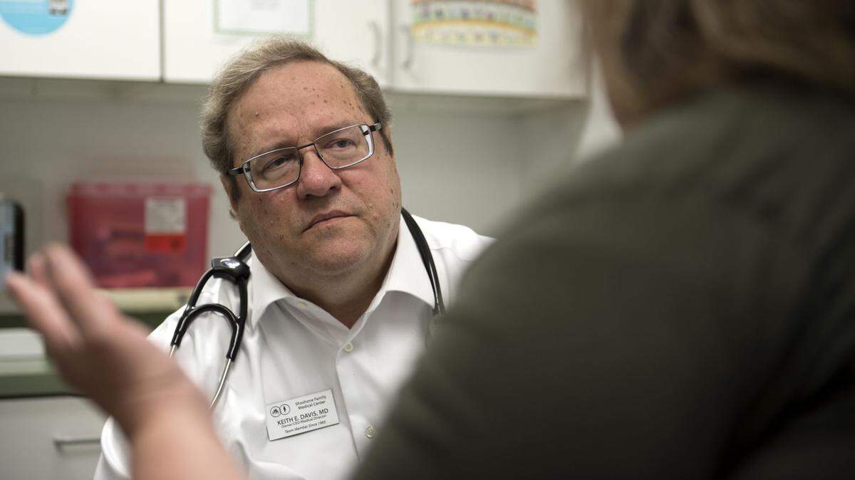 Dr. Keith Davis listens to a patient May 14, 2018 at Shoshone Family Medical Center.