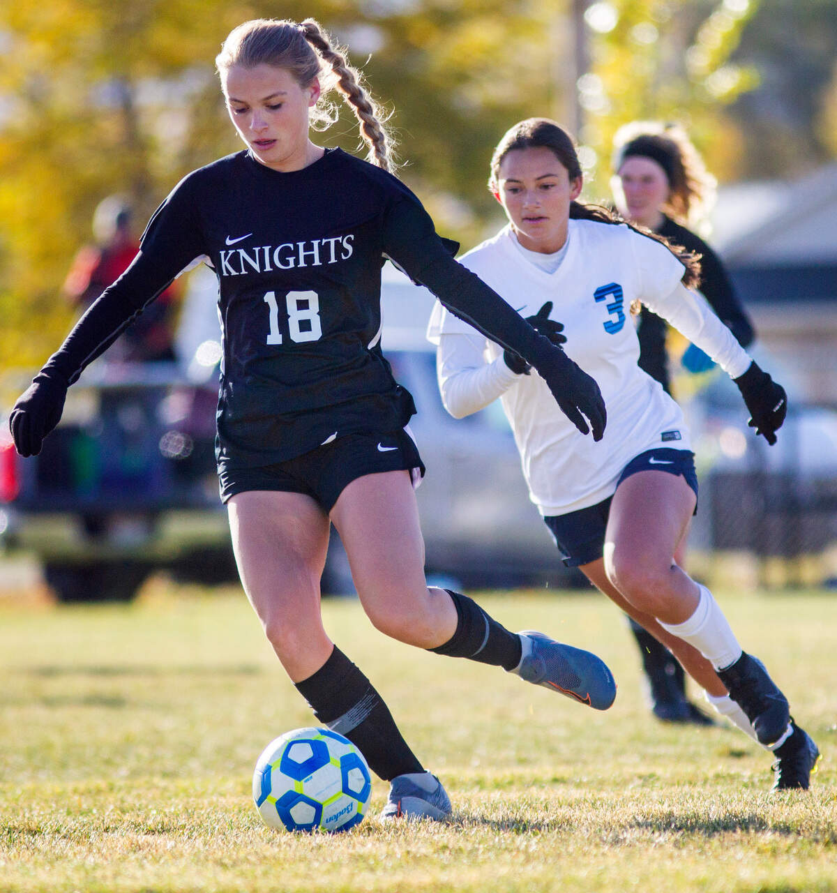 Bishop Kelly midfielder Margaret Smock takes possession of the ball before Twin Falls striker Jaycee Bell can catch her Thursday, Oct. 22, 2020, during the first round of the 4A girls soccer state tournament at Hillcrest High School in Ammon. Twin Falls defeated Bishop Kelly 3-2.