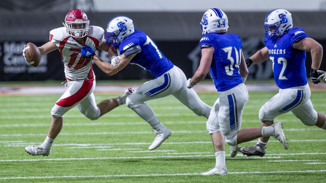Homedale tight end Spencer Fisher is chased in the backfield for a loss by Sugar-Salem’s Kyler Dalling in the 3A state football championship Saturday, Nov. 23, 2019 at Holt Arena in Pocatello.