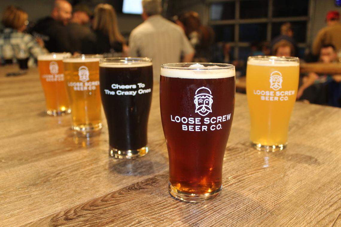 In this file photo from early 2020, Loose Screw Beer Co. pints at the Garden CIty taproom sported the logo “Cheers to the crazy ones.”