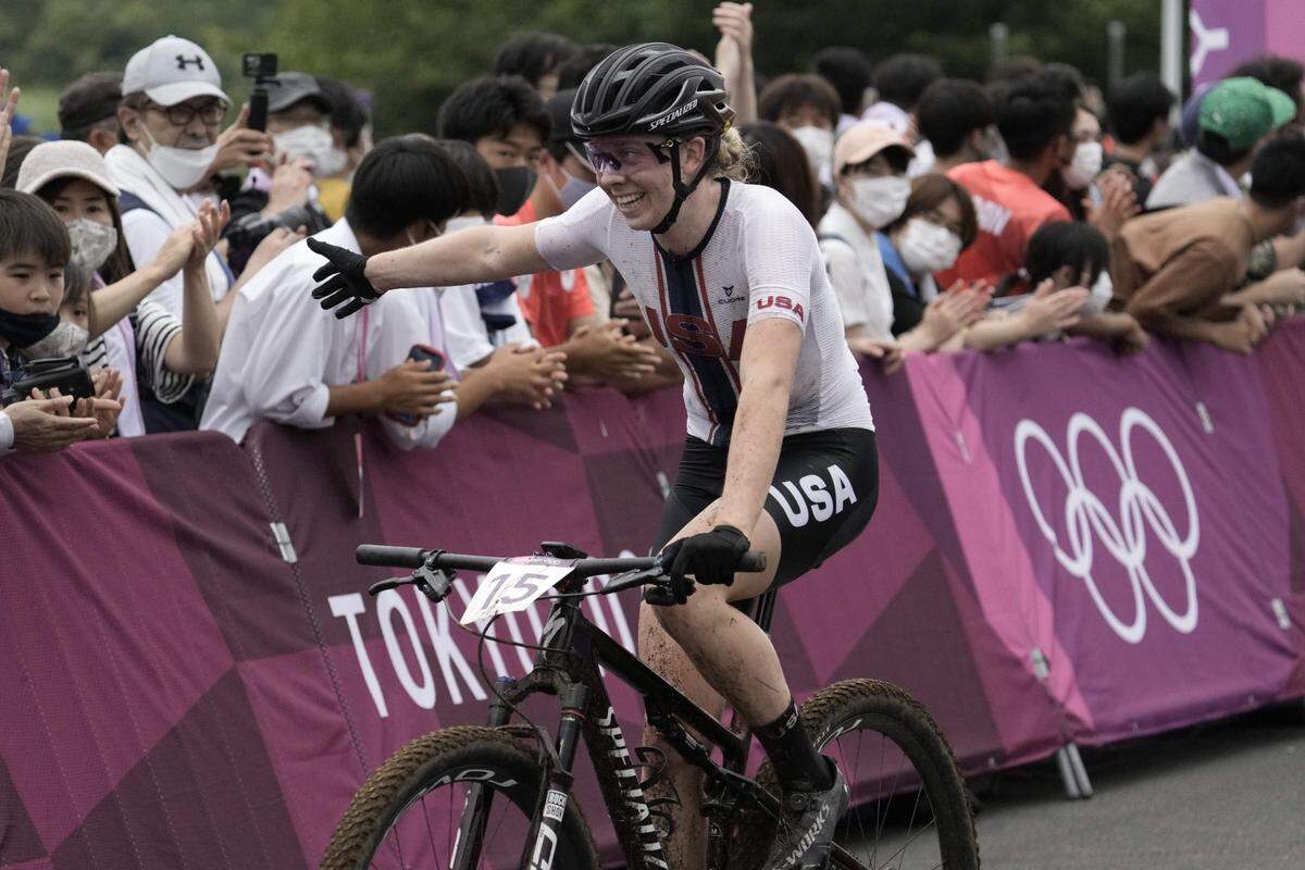 Jul 27, 2021; Tokyo, Japan; Haley Batten (USA) celebrates crossing the line in the Women's Cross Country during the Tokyo 2020 Olympic Summer Games at Izu MTB Course. Mandatory Credit: Andrew P. Scott-USA TODAY Network