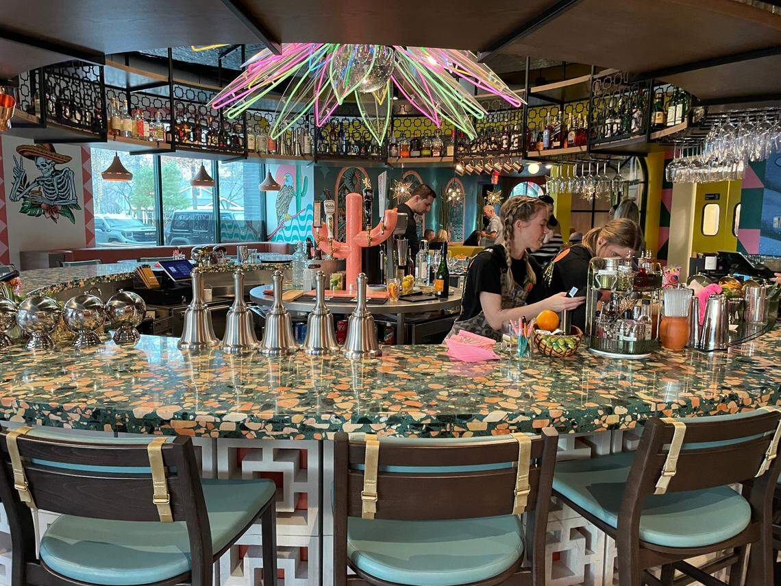 Draft beers are poured from taps on a pink cactus.