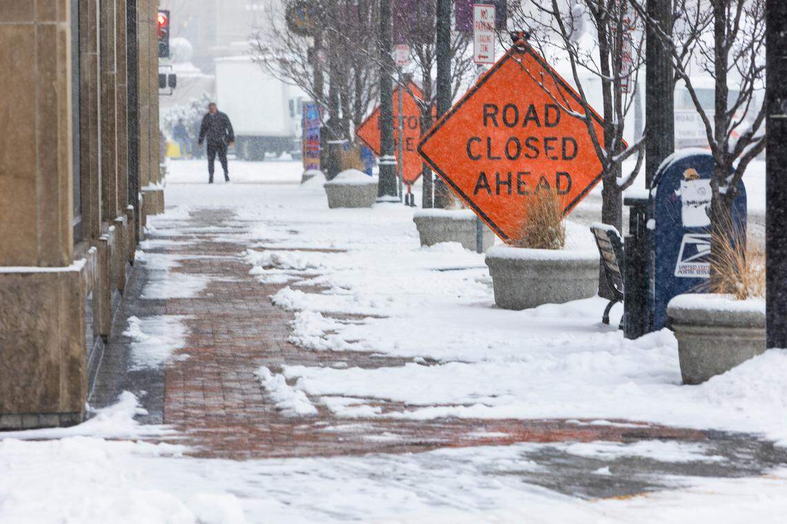 Snow makes a mess of the sidewalks along Capitol Blvd. in downtown Boise on Dec. 29, 2021 in which crews are preparing to close the street for Friday night’s New Year’s Eve Potato Drop event. The National Weather Service is forecasting very cold temperatures in the Treasure Valley from Friday night through Sunday. Snow will continue on Thursday.