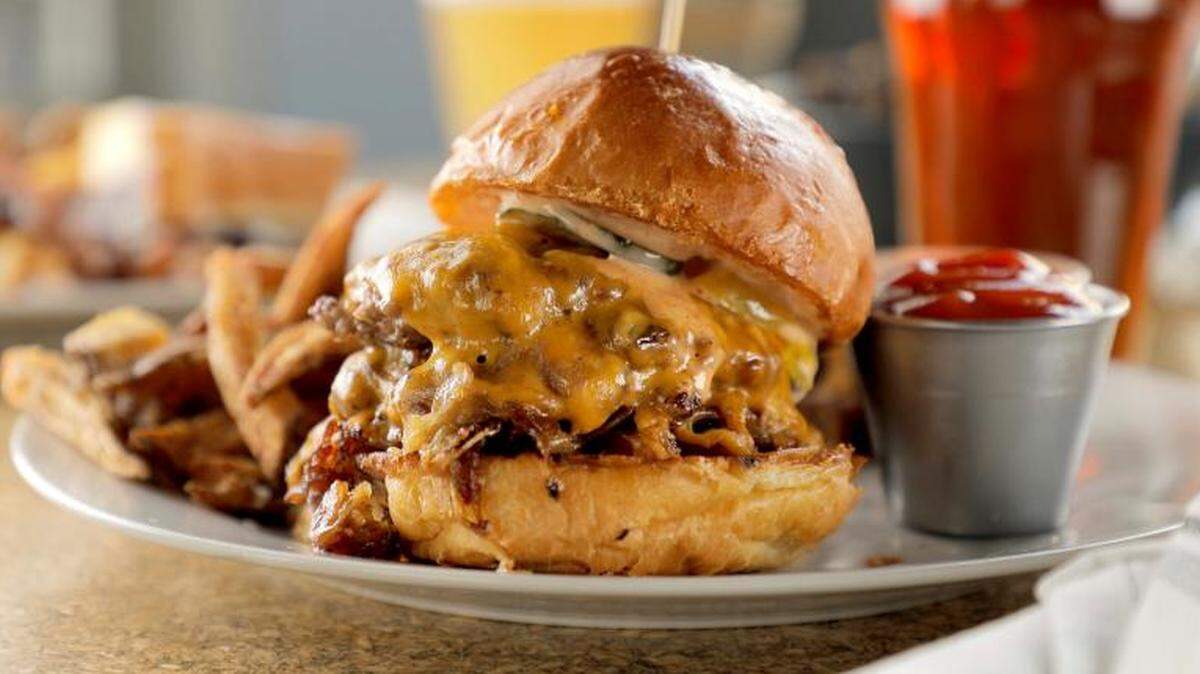A melt-in-your-mouth feast, the Gridiron Burger will be featured on “Diners, Drive-ins and Dives.”