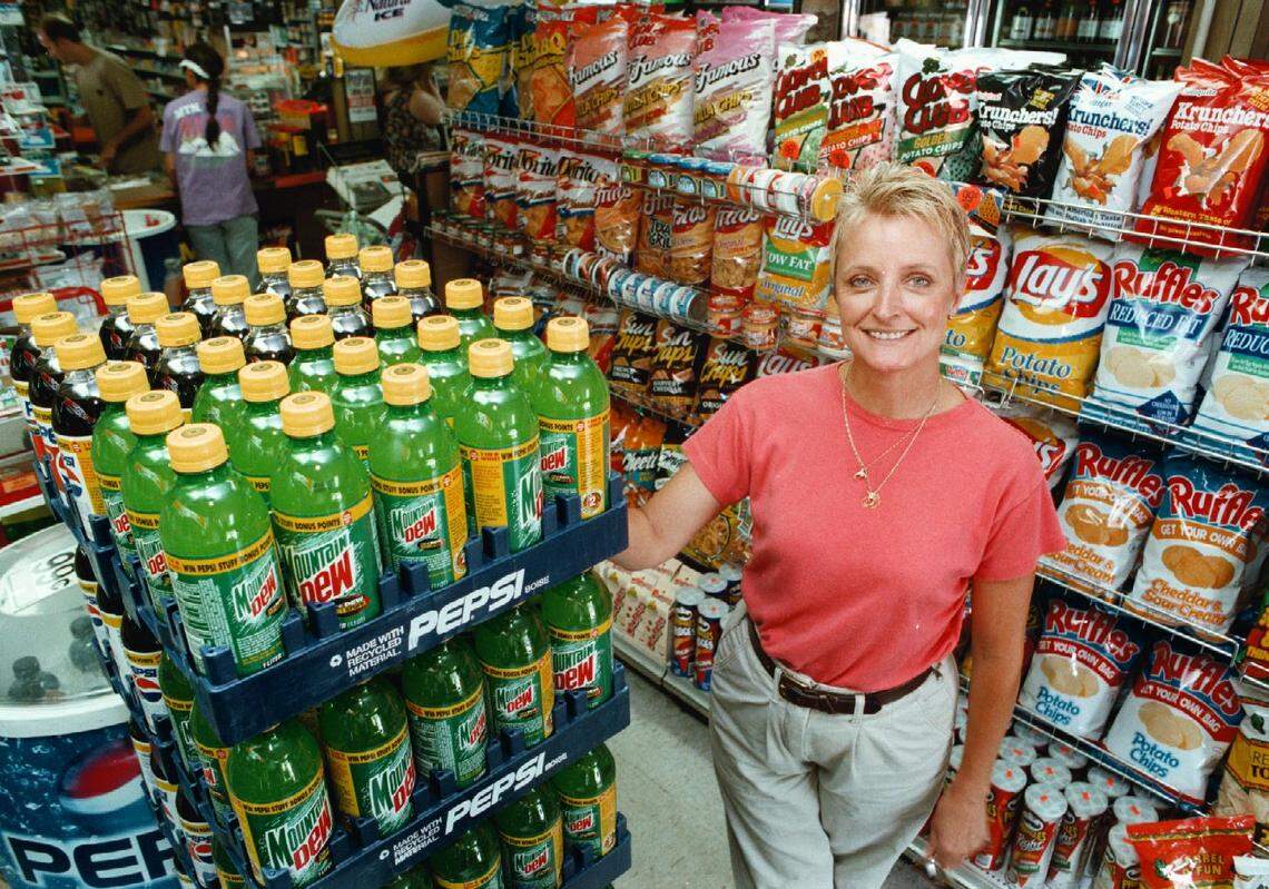 Melinda Burt, who at the time was the co-owner of Jerry’s 27th Street Market, stands inside the store in 1997. She ran the store with her husband, Jerry, and they provided neighborhood residents the convenience of shopping near home.