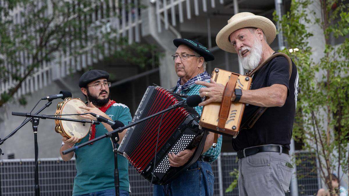 Musicians Jean-Jules Flesher, left, Jean Flesher, center, and Dan Ansotegui, right, perform Basque folk music at Kaixo Corner during Jaialdi, Thursday, July 31, 2025. Kaixo Corner is a new park located adjacent to Boise's Basque Block downtown.