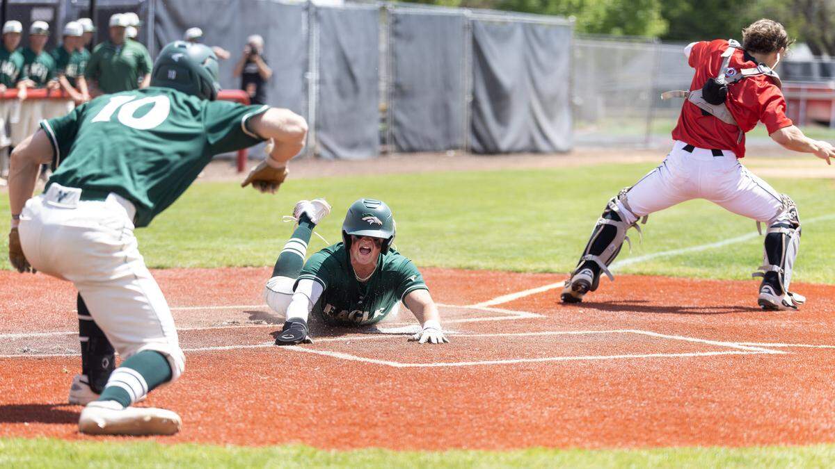 Eagle senior Caleb Zawadzki slides into home plate in the fourth inning of their game against Owyhee for the 6A District Three baseball tournament championship title, held at Fort Boise, Saturday, May 2, 2026. Owyhee won 4-2.