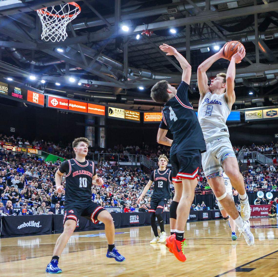 Preston senior Reggie Larsen, right, was voted the 5A All-Idaho Player of the Year by the state’s coaches.