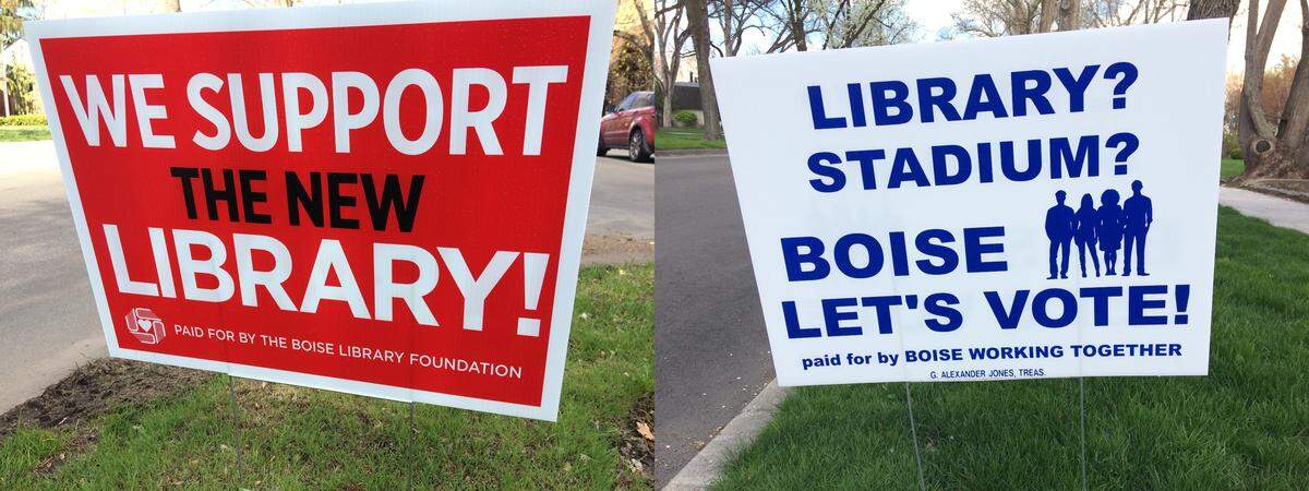 Campaign-style lawn signs reflect both sides of the dispute over Boise’s proposed new library.
