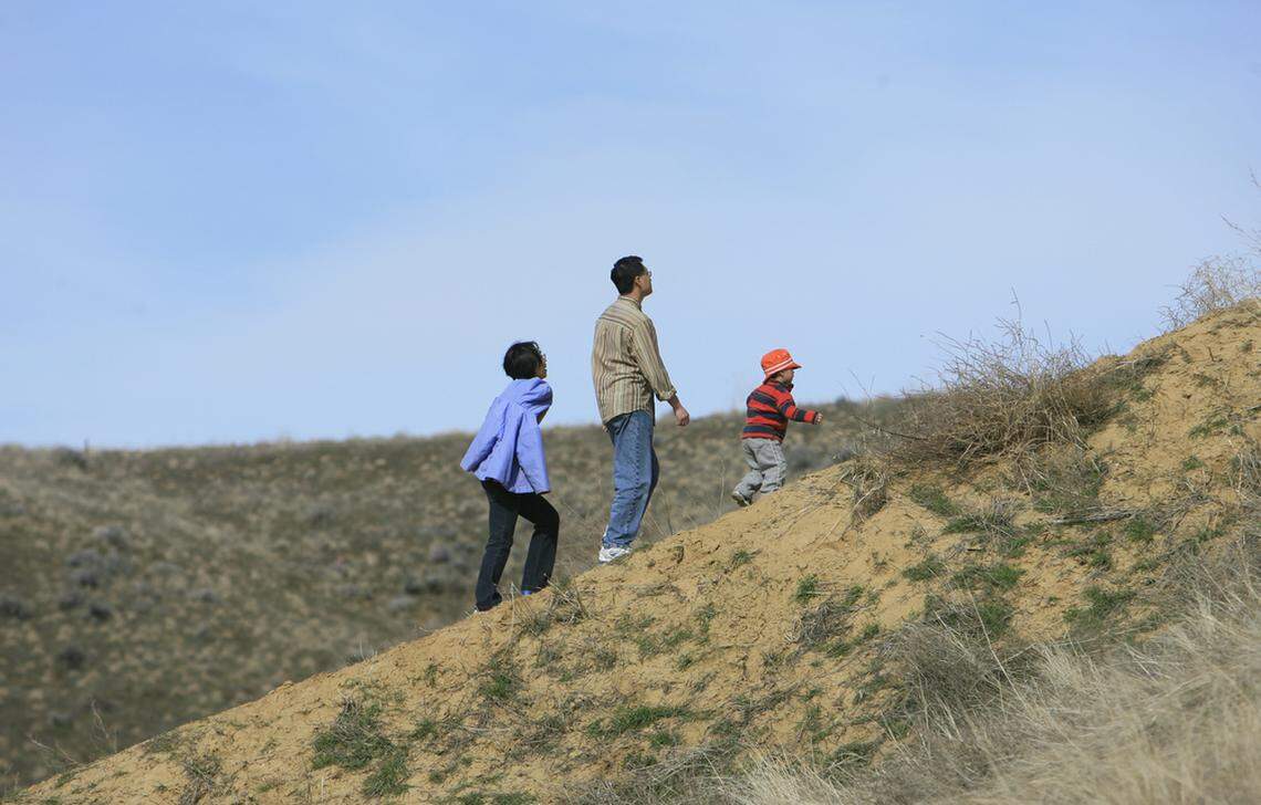 People enjoy the sunshine and warmer temperatures at Came's Back Park.
