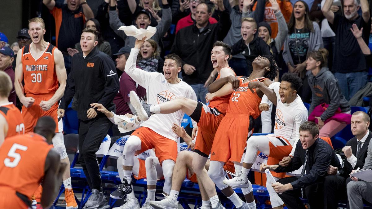 Idaho State’s bench and fans celebrate a 72-70 upset win over Boise State on Saturday at Taco Bell Arena in Boise. The Bengals fought their way back from an 18-point deficit.