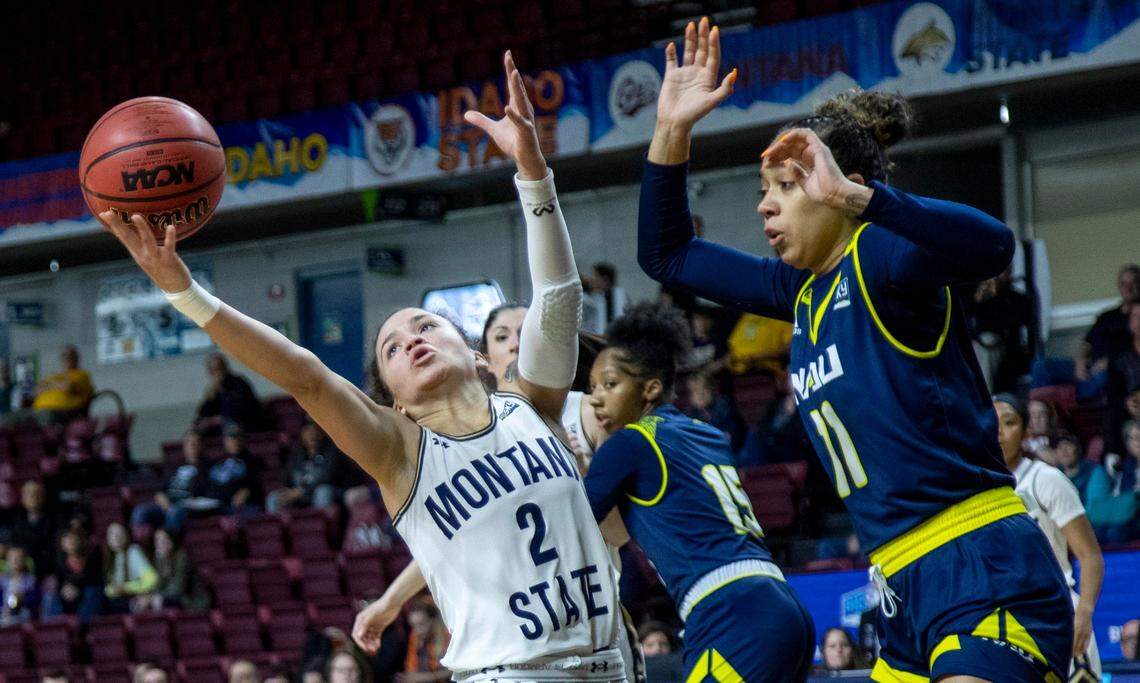 Montana State guard Darian White reaches for the ball on offense defended by Northern Arizona’s Jacey Bailey in the semifinals of the Big West women’s basketball tournament on March 11 at CenturyLink Arena in Boise. The coronavirus pandemic halted the tournament before the championship game could be played.