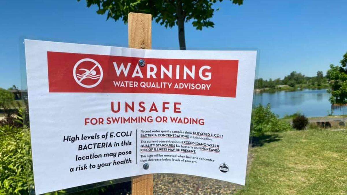 A warning placed at Esther Simplot Pond I warns visitors to swim at their own risk due to elevated levels of E. coli. High levels of the bacteria were also reported at the beach area of Quinn’s Pond, Boise Parks and Recreation officials said.