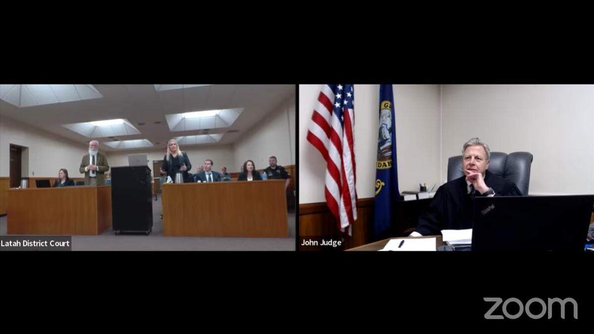 Judge John Judge, right, of Idaho’s 2nd Judicial District in Latah County, oversees a pretrial hearing for University of Idaho student homicide suspect Bryan Kohberger on Wednesday at the courthouse in Moscow. Kohberger’s public defender, Anne Taylor, center, standing, sparred with Latah County Prosecutor Bill Thompson, left, standing, in the contentious hearing.