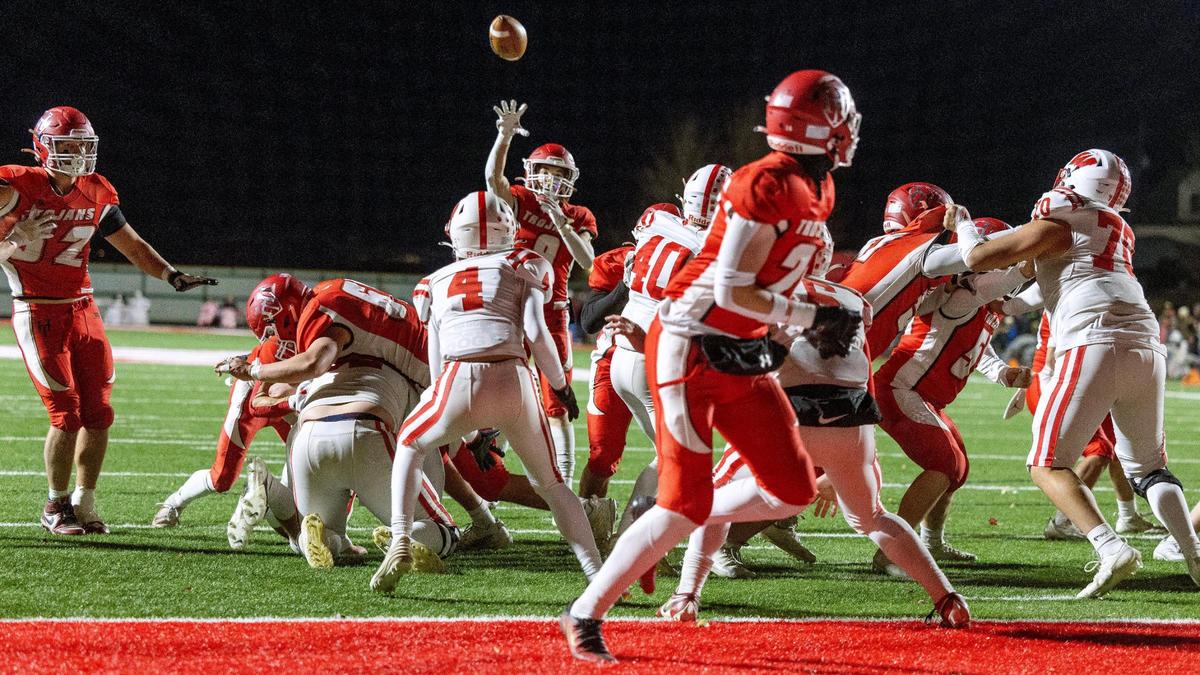 Homedale wide receiver Luke Henry throws a touchdown pass to Lukas Hall last week in the 4A semifinals.