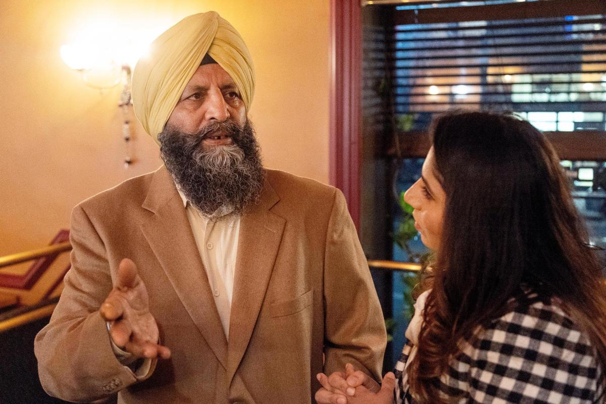 Mehar Singh, owner of Boise restaurant Bombay Grill, speaks through translation by his daughter Simran Kaur during a special dinner event for Sikh Awareness and Appreciation Month at the restaurant.
