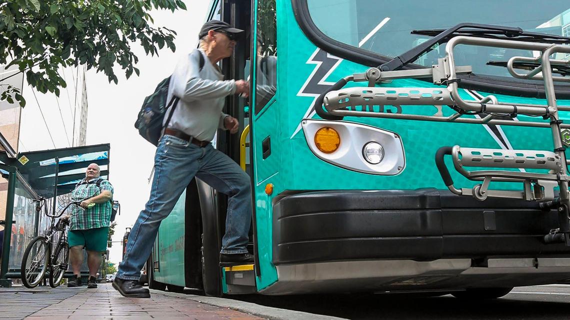 Commuters board an electric-powered bus operated by Valley Regional Transit in downtown Boise. A recent $17.4 million federal grant added eight additional electric buses to VRT’s fleet.