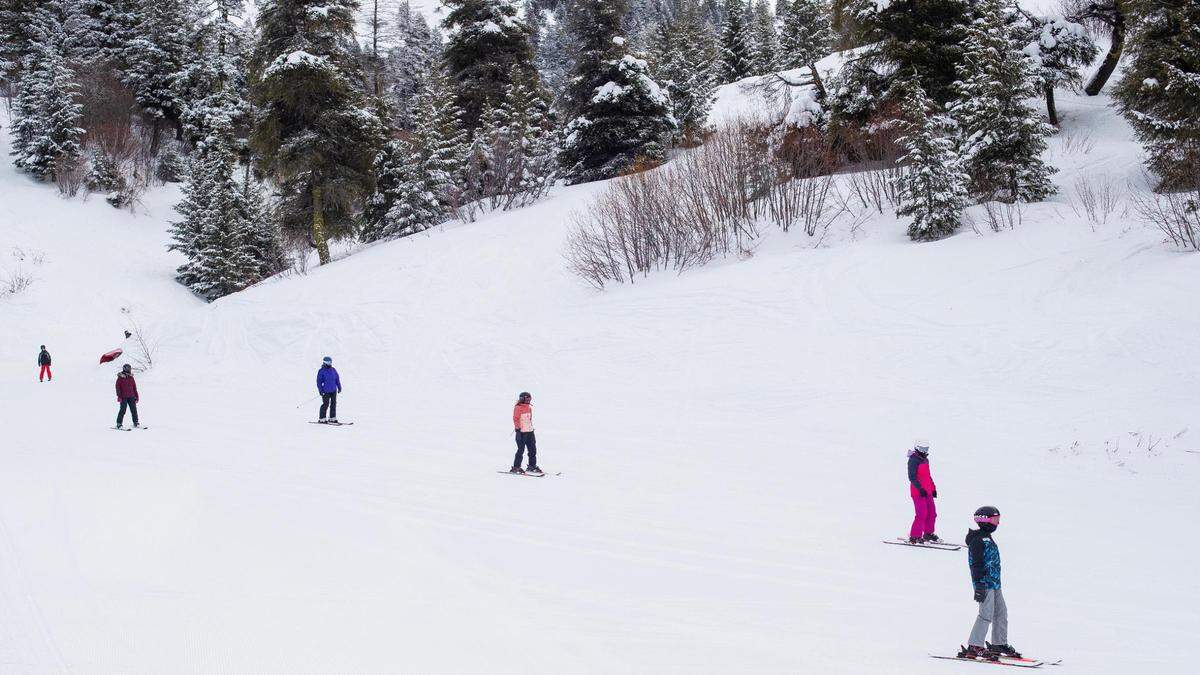 People ski in the morning with temperatures below 15 degrees at Bogus Basin in January.
