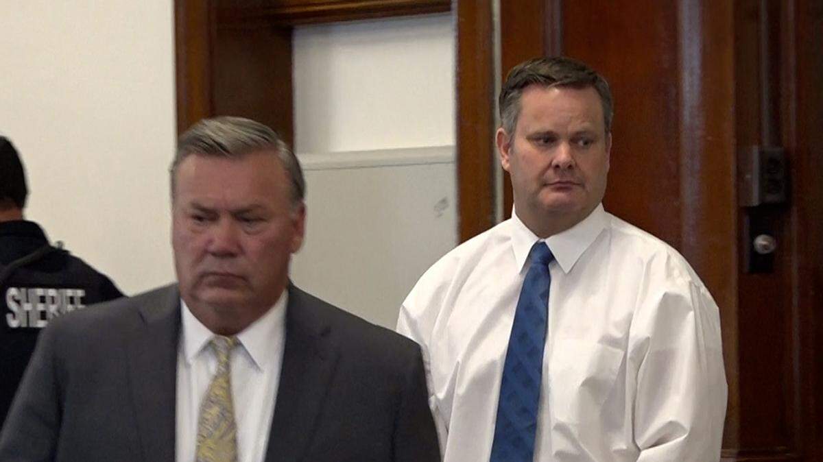 Chad Daybell, rear, walks into an April 2022 court hearing with his attorney John Prior.