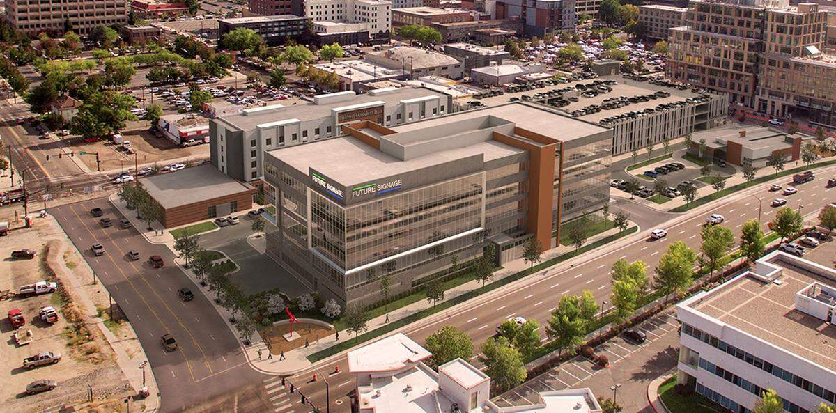 A five-story office building pictured here in an artist's rendering will anchor the Pioneer Crossing development, which includes the Hilton Garden Hotel, left rear, an 829-space parking garage, right rear, and a building in front of the garage housing a Panera Bread restaurant.