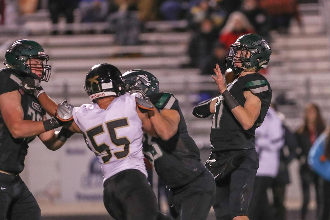 Eagle quarterback Mason McHugh connects for one of his six touchdowns against Capital in the first round of the 5A state football playoffs Friday at Eagle High. 
