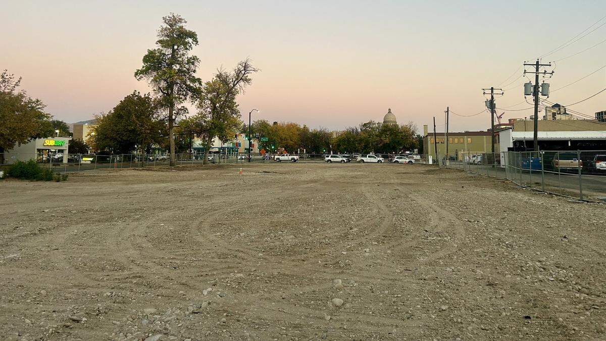 Crews demolished two former YMCA buildings on State Street, shown here, to make way for a new seven-story apartment building. This image from 12th Street is facing southeast, with State Street at left, the downtown Boise YMCA at center left near the Subway sandwich location and the Idaho Capitol in center.