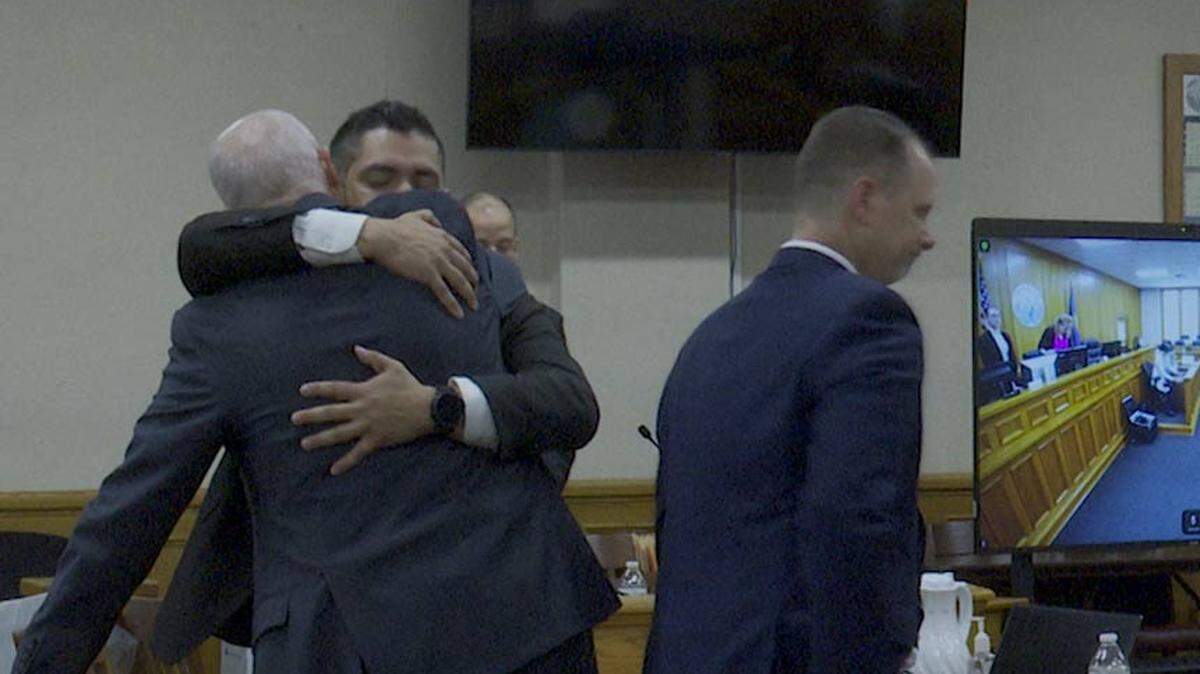 Elias Cerdas, right, hugs his attorney, Curtis Smith, after the judge’s decision.