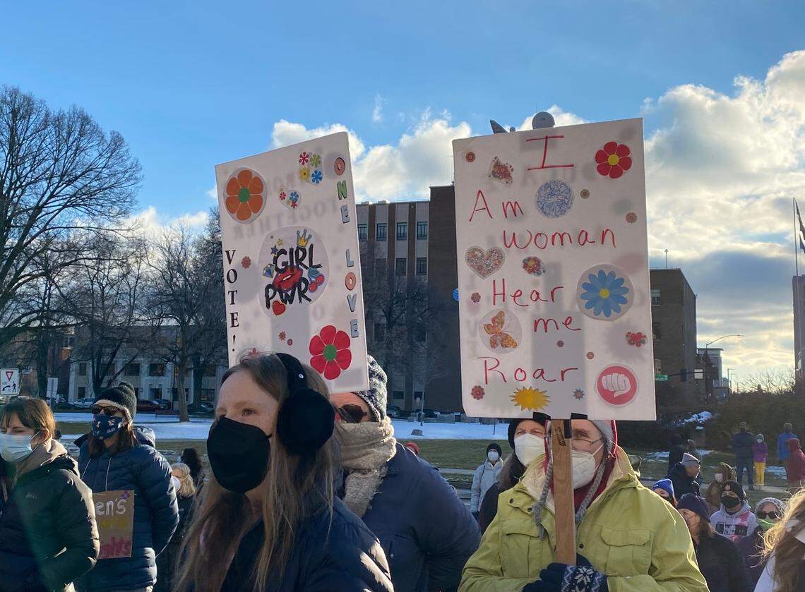 Demonstrator’s hold up signs in support of Women’s rights during Saturday’s sixth annual Women’s March.