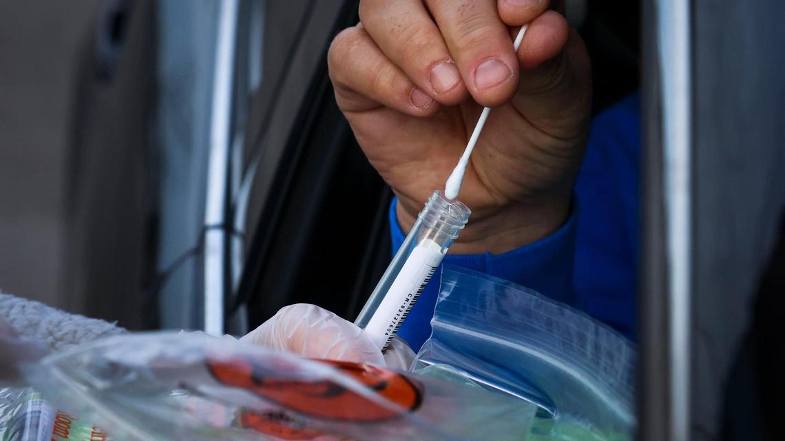 Crush The Curve collects COVID-19 test samples at a drive-up site in Meridian in January. At its peak, the omicron wave left local state health districts with over 44,000 unprocessed positive tests.