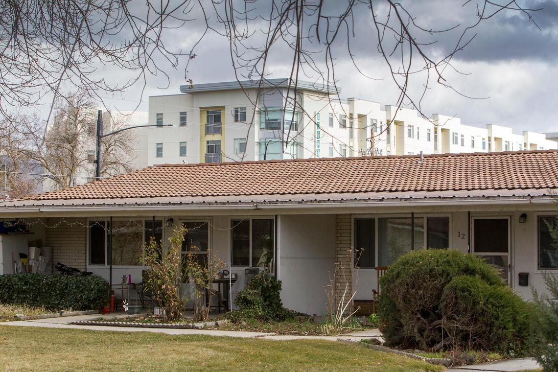 The five-story Identity Boise apartments, which opened in 2018, loom over the Ridenbaugh Place Apartments across Boise Avenue.