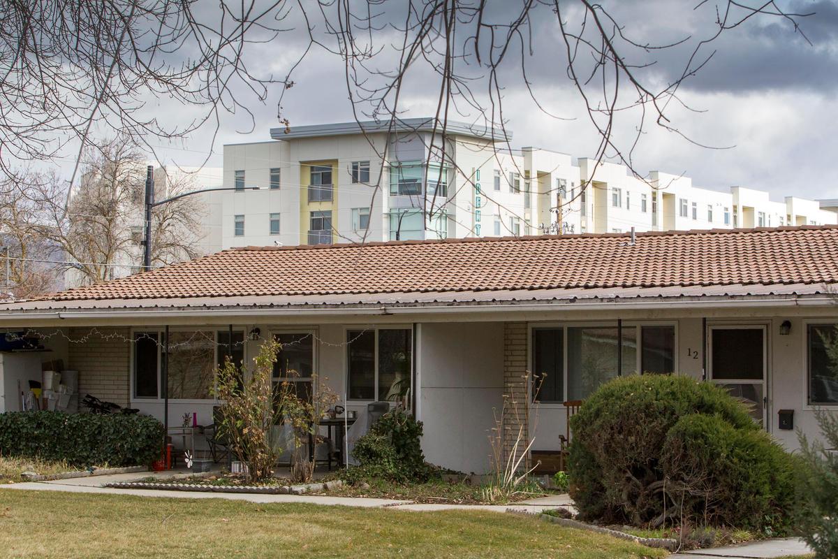 The five-story Identity Boise apartments, which opened in 2018, loom over the Ridenbaugh Place Apartments across Boise Avenue.