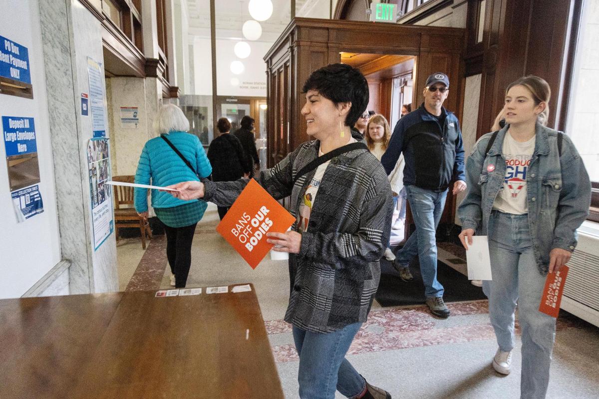 Nicky Topete of Boise mails a letter at the downtown post office to Idaho Governor Brad Little as part of a protest over Senate Bill 1309 held on March, 19, 2022. The proposed law would ban abortion after 6-weeks from conception. Attendees of the rally organized by Freeing Idaho, a coalition of organizations supporting reproductive freedom, are calling on Governor Little to veto the bill.
