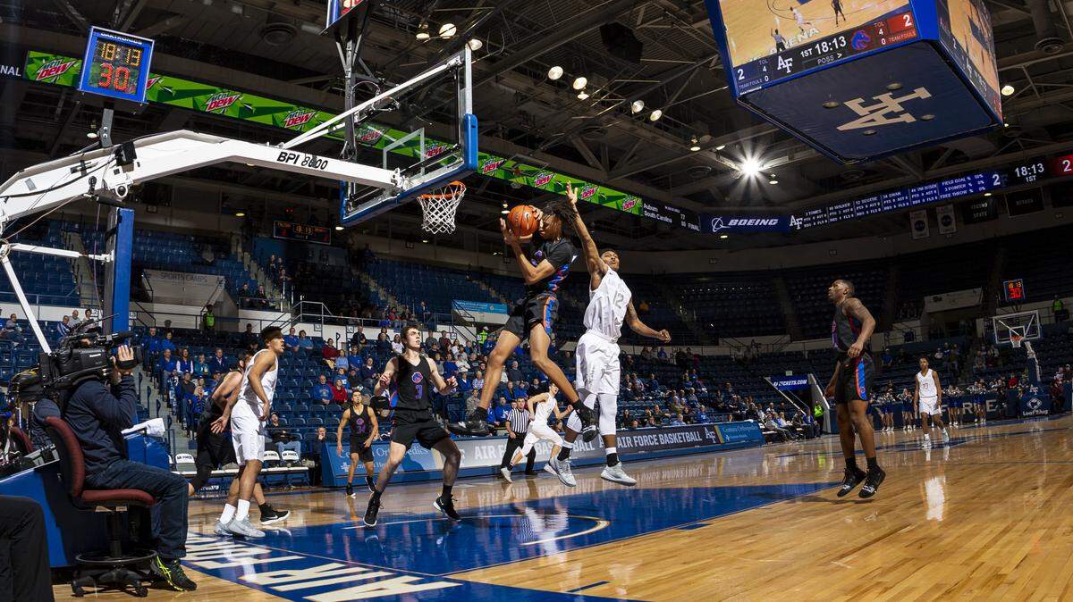 Boise State guard Derrick Alston snatches a rebound from Air Force forward Lavelle Scottie in the first few seconds of the game Tuesday at Clune Arena in USAFA, Colorado. The Falcons won 74-60.
