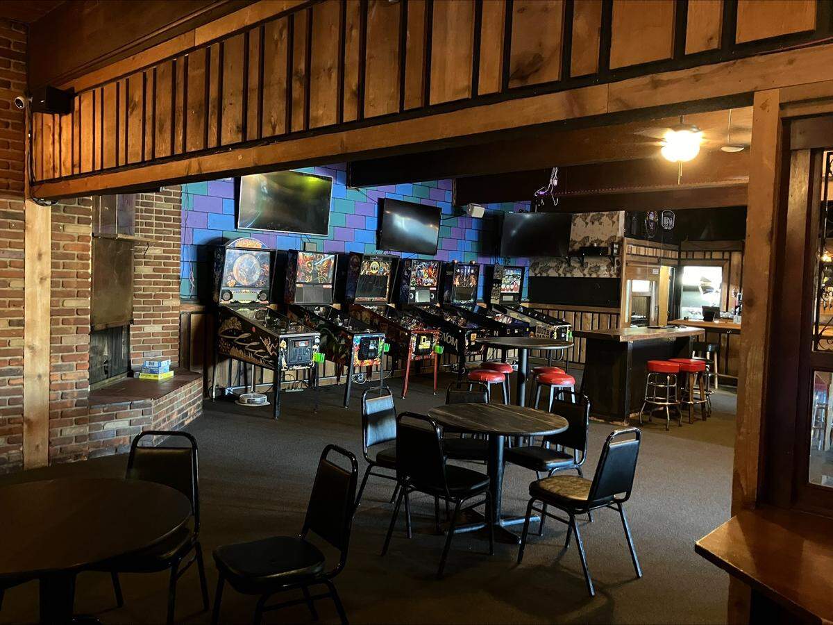 Pinball machines and pool tables offer entertainment at the reopened bar.