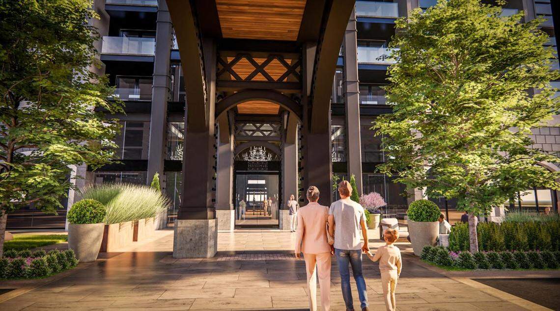 The rendering shows a couple walking under the bridge that would connect the two apartment buildings.