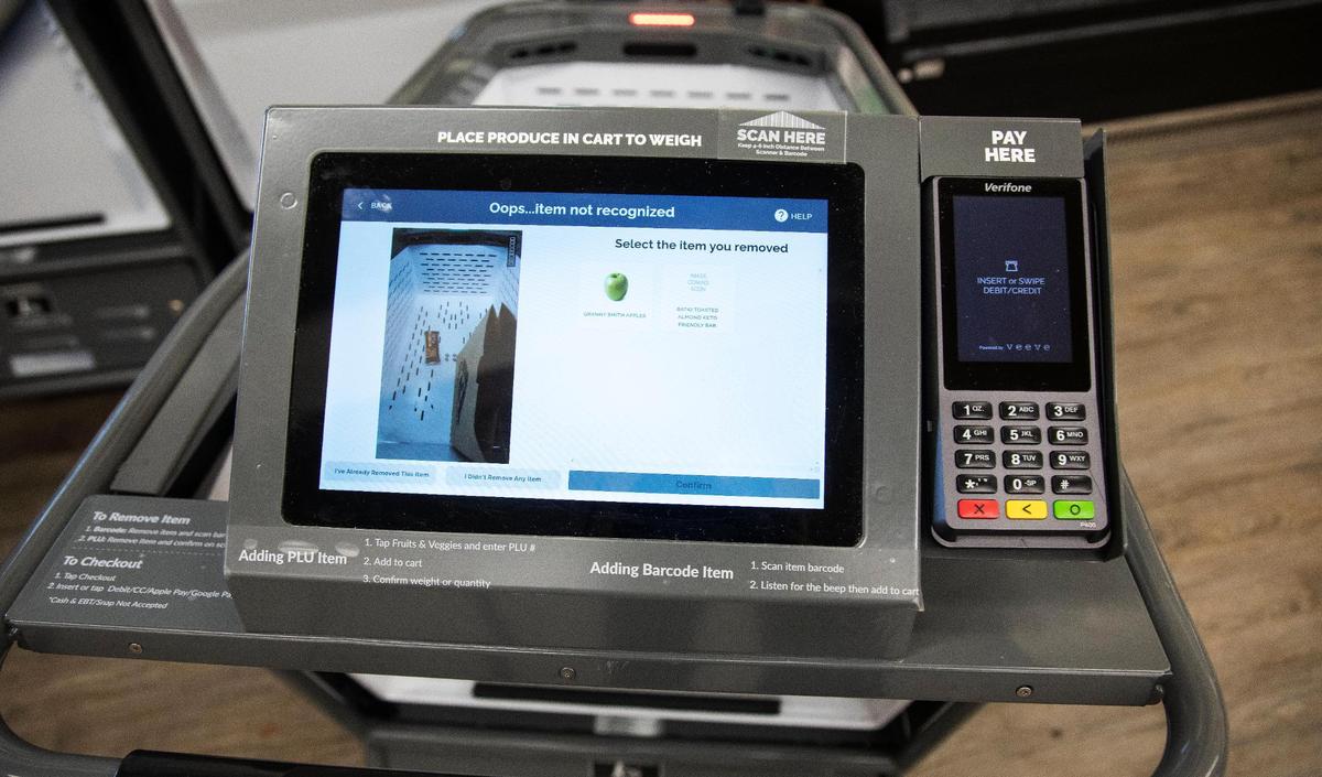 The Veeve shopping cart, pictured at an Albertsons store in Eagle, Idaho, uses computer technology to allow customers to scan item barcodes, weigh produce in basket, and use contactless payment straight from the grocery cart.