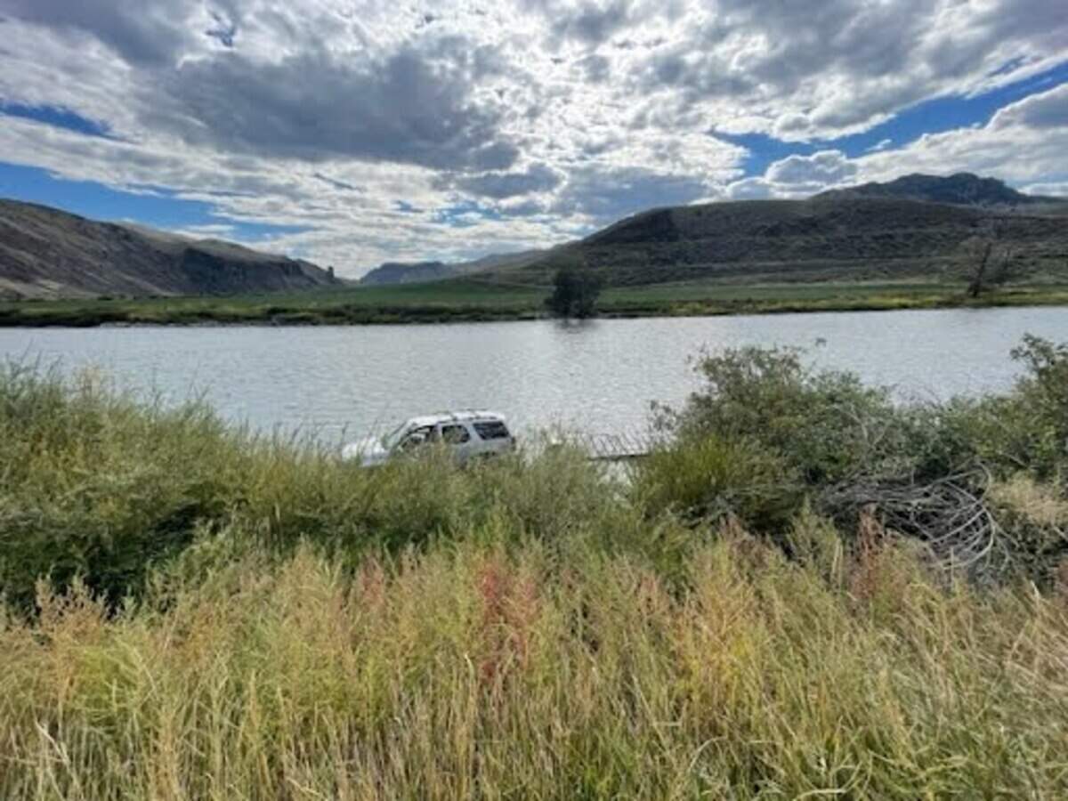 Michelle Visser’s 2010 Chevy Tahoe sits in the Salmon River on Sept. 17, 2023. Visser’s family hired Whitewater River Shuttle to move the vehicle from Salmon to Carey Creek, but the driver crashed the car shortly outside Salmon.