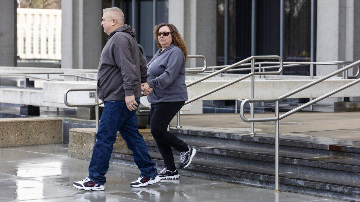 Charles “Abe” Abrahamson, left, and his wife Robin Abrahamson exit the James A. McClure Federal Building in Boise after his arraignment on eight felony counts on Wednesday. Abrahamson, 56, a former Idaho American Legion commander, is charged with federal wire fraud and tax fraud in connection to allegations that he embezzled more than $1.45 million from the statewide military veterans nonprofit.
