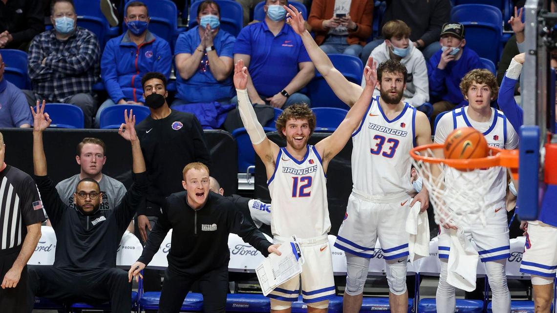 Boise State’s bench watches with anticipation as teammate Naje Smith’s hits a 3-pointer against Mountain West foe Wyoming on Tuesday at ExtraMile Arena in Boise. The Broncos added to their 13-game winning streak with a 65-62 win over the Cowboys and are now 7-0 atop the MW conference.