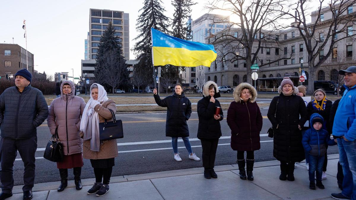 A woman holds a Ukraine flag during a rally last February at the start of the Russian invasion of its neighbor.