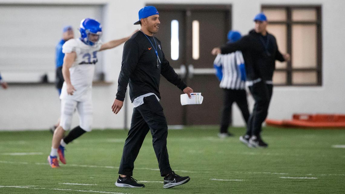 Boise State head coach Andy Avalos moves his players to a team-building competition during spring practice.