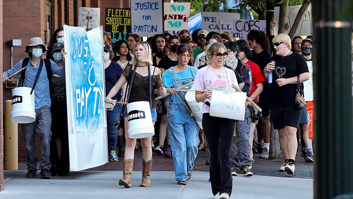 Protesters march around Boise City Hall decrying the fatal shooting of Payton Wasson by Boise police in June 2023.