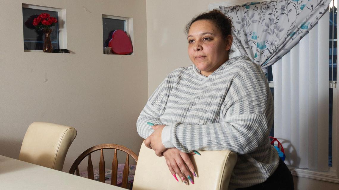Avalon Hardy stands by her children’s toys in her Boise apartment in 2023. 