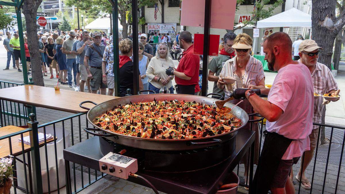 People wait in line for paella outside of The Basque Market in downtown Boise's Basque Block during Jaialdi, Thursday, July 31, 2025. Jaialdi, the largest Basque cultural festival in the United States, is happening in Boise through Sunday.