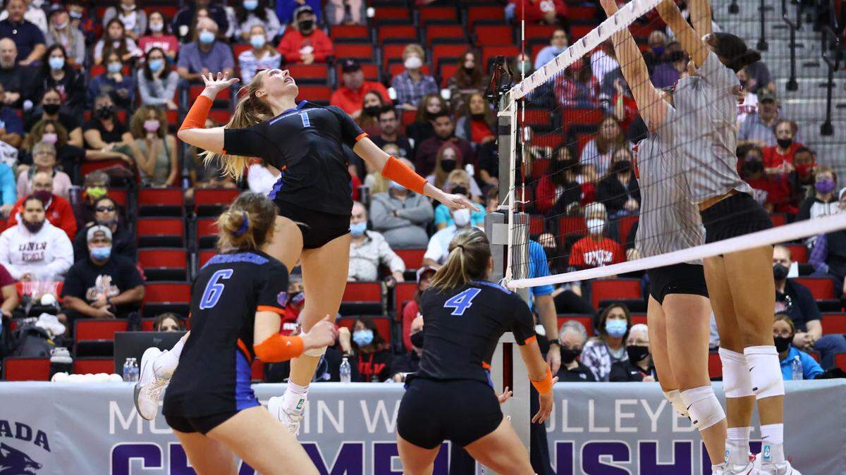 Boise State junior Lauren Ohlinger goes up for a kill in the Broncos’ championship match win over UNLV last Friday, as Danielle Boss (6) and Alyssa Wissinger (4) look on.