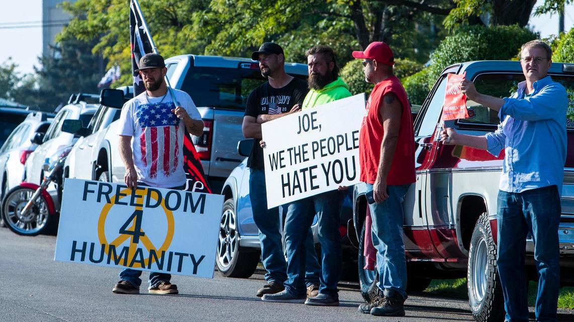Protesters gather along Airport Way near the National Interagency Fire Center in Boise where President Joe Biden visited Monday.
