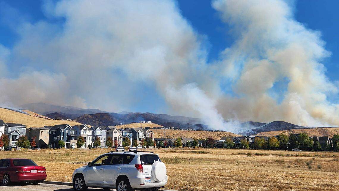 The Valley Fire burns Friday near subdivisions along Warm Springs Avenue.