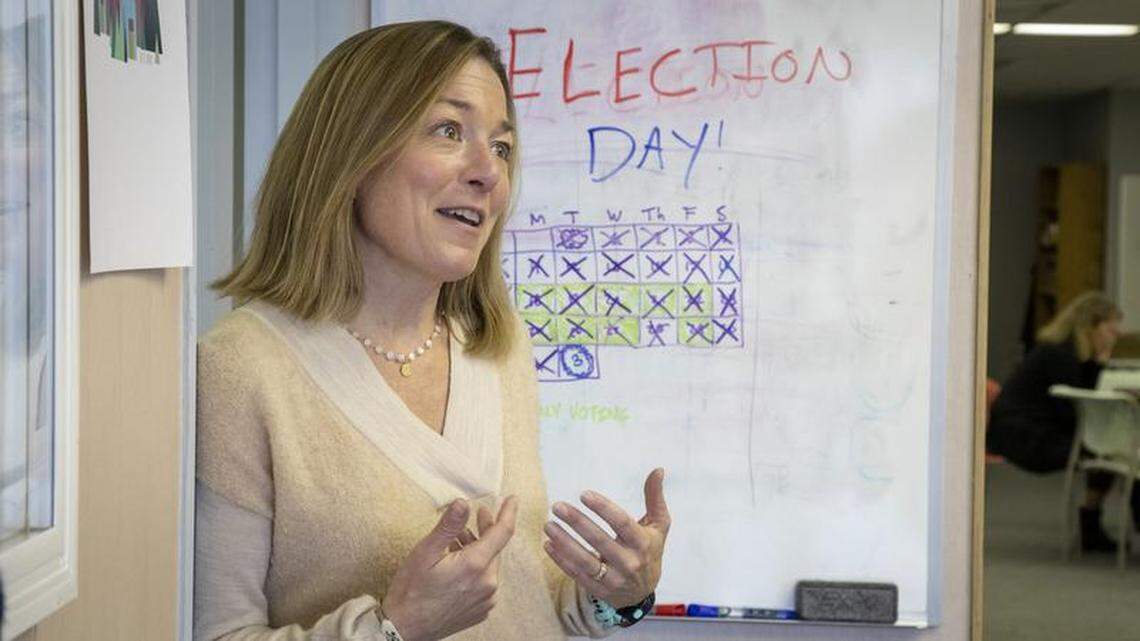 Mayoral challenger Lauren McLean explains her platform to a walk-in voter with questions at her campaign headquarters on Boise’s runoff election day.